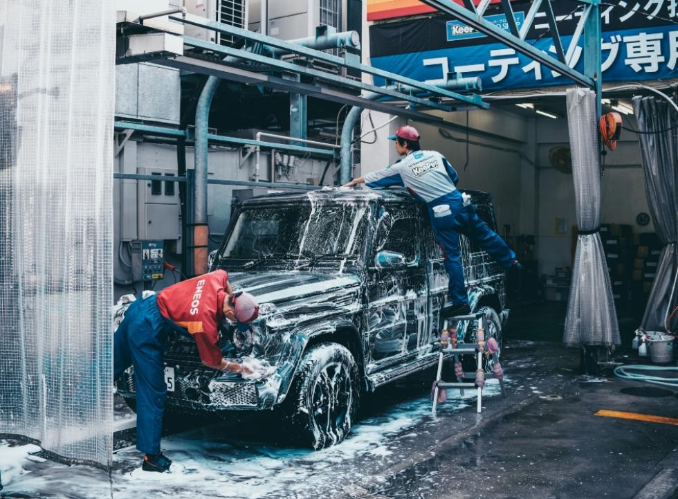 People washing truck